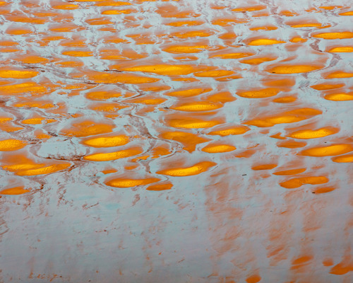 Reflections:  a group of orange and white objects
