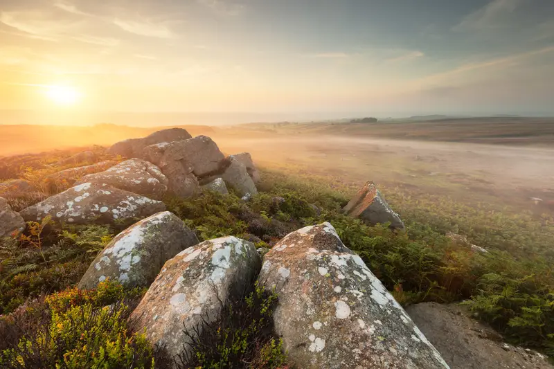 Moorland landscape with mist at dawn. a view of a rocky mountain. outdoor sky mountain rock landscape cloud nature rocky plant hill sunrise