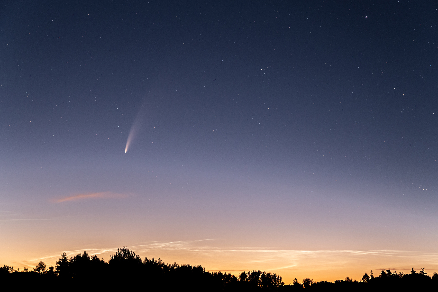 a person flying through the sky. sky outdoor sunset sun astronomy nature tree moon cloud outdoor object air star