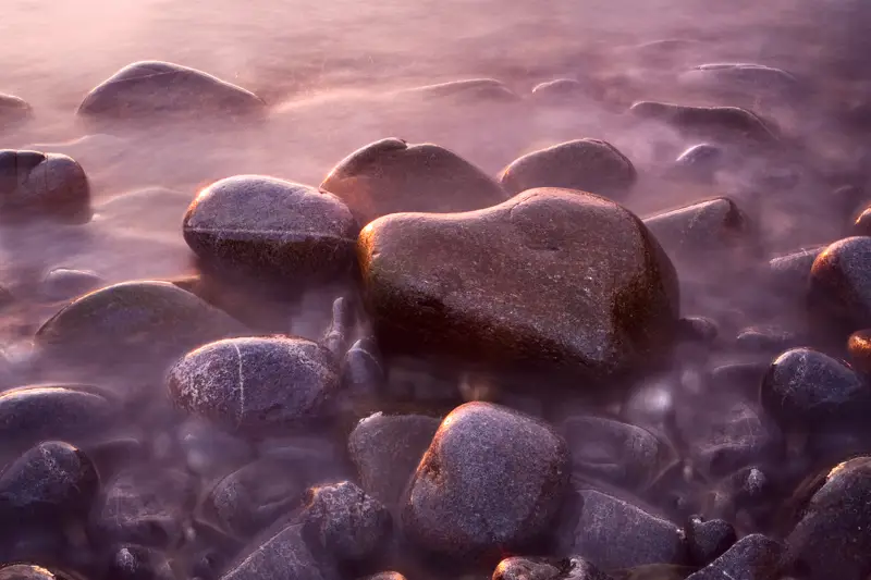 a group of rocks. nature outdoor water pebble rock landscape stone beach