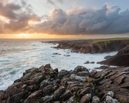Seascapes of the Outer Hebrides:  a rocky beach with a body of water in the background